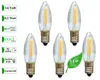 Five LED filament candle bulbs are arranged on a white background, with informational text labels on the left and a green leaf graphic with text on the right. Produktbild-Vorschau