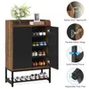 A shoe cabinet with multiple shelves and doors, displaying various shoes and decorative items. Anteprima dell’immagine prodotto