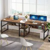 A spacious home office setup with a large wooden desk, two computer monitors, and chairs, positioned in front of a large window with a scenic view. Náhled obrázku produktu