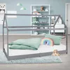 A child's bedroom with a house-shaped bed.
