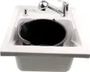 A white sink with a black bucket, a faucet, and a soap dispenser. Voir les images du produit