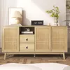 A light wood sideboard with rattan doors and drawers, decorated with a lamp, books, a camera, and a clock. Anteprima dell’immagine prodotto