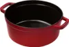A red cast iron Dutch oven is shown from a slightly elevated side angle against a white background. Voir les images du produit