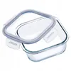 A clear glass food storage container with a blue and gray lid, shown from a diagonal angle. Anteprima dell’immagine prodotto