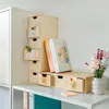 A wooden drawer unit with books and flowers on a shelf. Náhled obrázku produktu