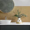 A bathroom vanity with a sink, faucet, mirror, and decorative items. Podgląd zdjęcia produktu