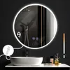A modern bathroom scene featuring a round, illuminated mirror above a sink. Produktbild-Vorschau