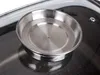 A close-up shot of a stainless steel aroma knob on a glass lid of a roasting pan. Podgląd zdjęcia produktu