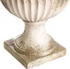 Close-up of the base of a decorative planter. Produktbild-Vorschau