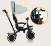 A multifunctional tricycle for children, shown from the side with a close-up inset of the handlebars. Produktbild-Vorschau