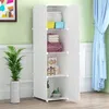 A white modular wardrobe with items stored inside, next to a potted plant and in front of a light green wall and blue curtain. Náhled obrázku produktu