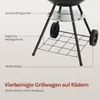 Close-up of the lower part of a black charcoal grill, showing its legs, wheels, and a lower shelf. Text labels point out different parts of the grill. Produktbild-Vorschau