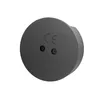 A close-up view of the back of a round, dark gray electronic device. Produktbild-Vorschau