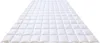 A white quilted duvet is laid out flat on a white background, extending into the distance. Produktbild-Vorschau