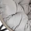 Close-up view of the gray cushions and woven frame of a hanging chair. Náhled obrázku produktu