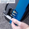 A close-up of a hand holding a white plastic adapter near a blue and black compressor with gold-colored attachments. Produktbild-Vorschau