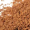 A close-up view of brown, granular streusel topping. Produktbild-Vorschau