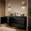 A modern living room with a black sideboard and decorative items. Produktbild-Vorschau