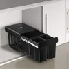 A black trash can with three compartments is pulled out from under a kitchen counter. Voir les images du produit