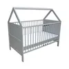 A gray baby crib with a house-shaped frame, shown against a white background. Produktbild-Vorschau
