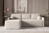 A modern living room with a beige sectional sofa, abstract art, and decorative lighting. Produktbild-Vorschau