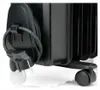 A close-up view of the bottom section of a black electric heater, showing the power cord and a wheel. Anteprima dell’immagine prodotto