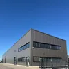 A modern industrial building with a clear blue sky. Podgląd zdjęcia produktu