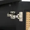 A close-up view of a cabinet hinge on a black cabinet door. Anteprima dell’immagine prodotto