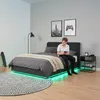 A bedroom scene with a bed, a person using a phone, and decorative elements. Produktbild-Vorschau