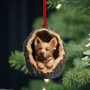 A Christmas ornament of a dog in a wooden hollow hanging on a Christmas tree. Produktbild-Vorschau