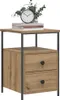 A bedside table with two drawers and a wooden top, decorated with a clock and some plants. Voir les images du produit