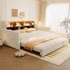 A bedroom scene featuring a multifunctional sofa bed with an extended trundle bed, showcasing its integrated storage and LED lighting. Voir les images du produit