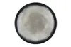 A top-down view of a round ceramic plate with a dark blue rim and a textured gray center. Produktbild-Vorschau