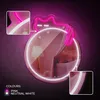 A neon cat light with a mirror in a bedroom setting. Produktbild-Vorschau