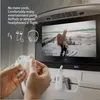 A person is holding a white charging case for wireless earbuds in front of an airplane seatback screen showing a video. Anteprima dell’immagine prodotto