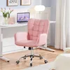 A pink office chair is shown in a home office setting. Podgląd zdjęcia produktu