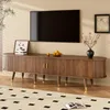 A living room scene featuring a TV stand with a television mounted above it. Anteprima dell’immagine prodotto