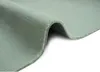 A close-up, angled view of a soft, short-pile rug, folded to show its texture and underside. Produktbild-Vorschau