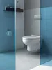 A modern bathroom with a wall-mounted toilet and a glass partition. Produktbild-Vorschau