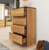 A wooden chest of drawers with black trim is shown in a room setting. Produktbild-Vorschau
