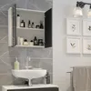 A modern bathroom with a sink, medicine cabinet, and decorative framed pictures on the wall. Náhled obrázku produktu