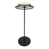 A black metal clothing rack with a round wooden top, displayed on a white background. Podgląd zdjęcia produktu