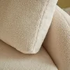 A close-up view of a cream-colored teddy bouclé fabric, likely from a sofa or cushion. Anteprima dell’immagine prodotto