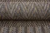 A close-up view of a rolled-up rug with a woven pattern. Náhľad obrázku produktu