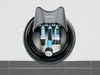 A garden hose holder with a coiled hose and accessories mounted on a wall. Anteprima dell’immagine prodotto