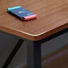 A close-up view of a Nintendo Switch console on a wooden desk. Náhľad obrázku produktu