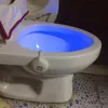A toilet bowl with a blue LED light illuminating the water. Voir les images du produit
