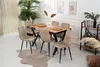 A dining room set with a wooden table and beige chairs, decorated with plants and artwork. Produktbild-Vorschau