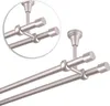 A close-up view of a double curtain rod system mounted to a ceiling. Podgląd zdjęcia produktu