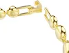 A close-up shot of a gold-colored bracelet clasp and chain. Anteprima dell’immagine prodotto